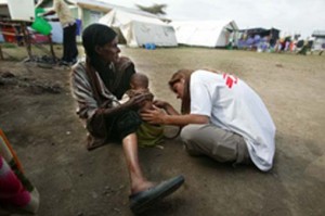 An MSF aid worker examines a malnourished child during a nutritional crisis in Ethiopia (2008) Picture by Juan Carlos Tomasi/MSF