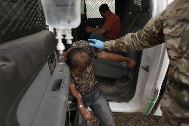 U.S. Customs and Border Protection photo: BORSTAR agents provide first aid to illegal alien