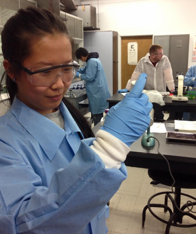 Photograph of nursing students in a lab at New England Collefe