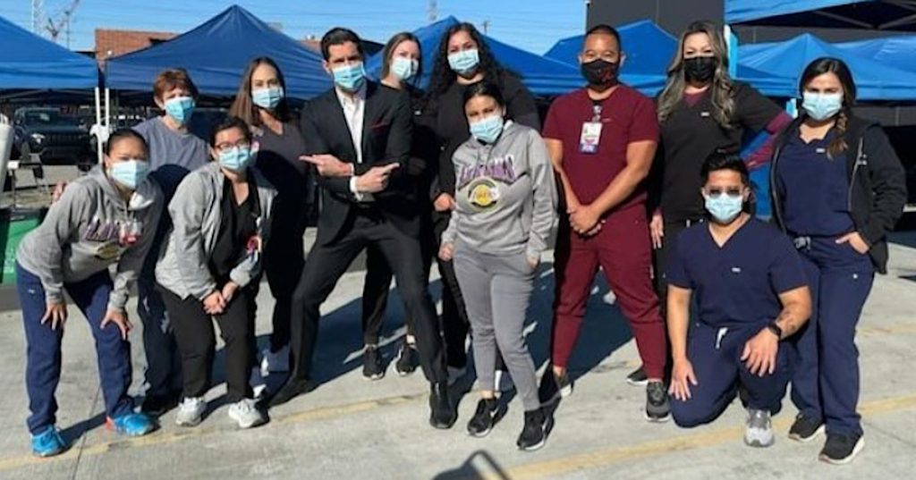 Tom Ellis (Lucifer) with Edlynn Villalon and her colleagues of the COVID RN/LVN Team - December 2022 photo contest winner