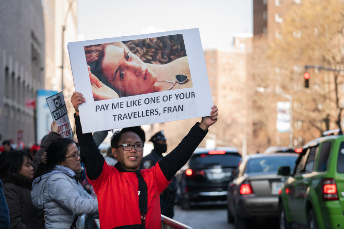 Titanic-themed protest sign: "Pay me like one of your travellers, Fran"